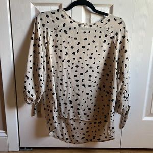 Beige animal print blouse size M. Zip back and tie sleeves